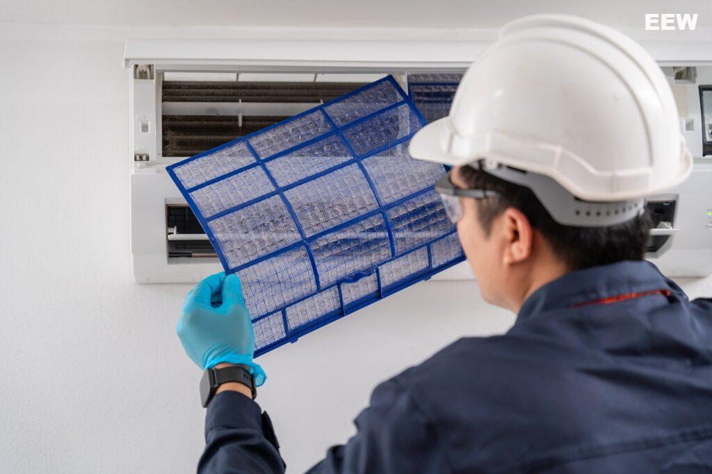 Air Technician Service Removing Air Filter Of The Air Conditione