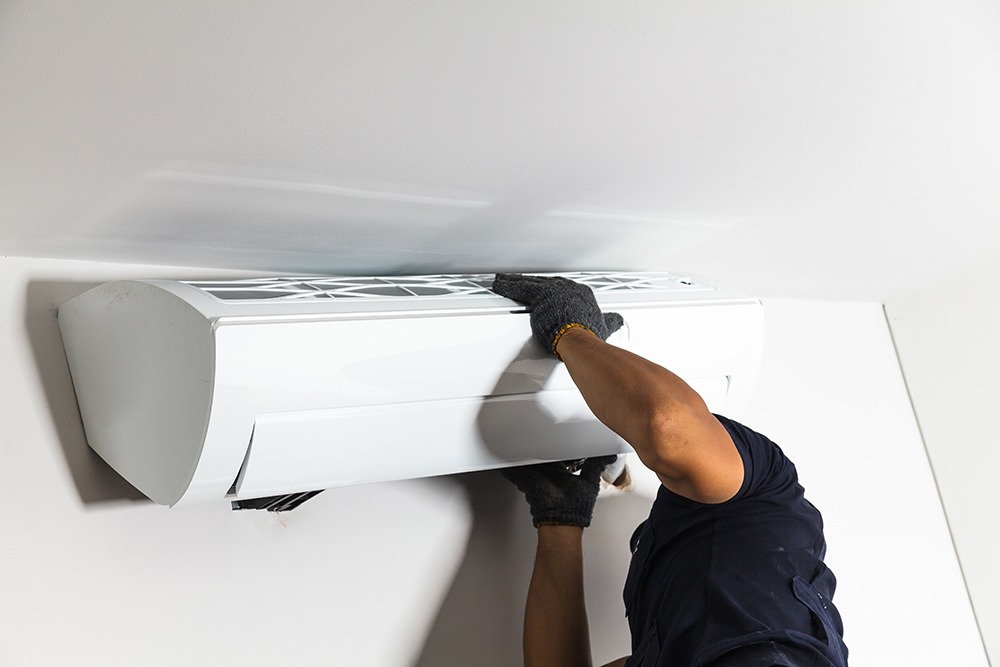 Technician Air Conditioning Installs The New Air Conditioner